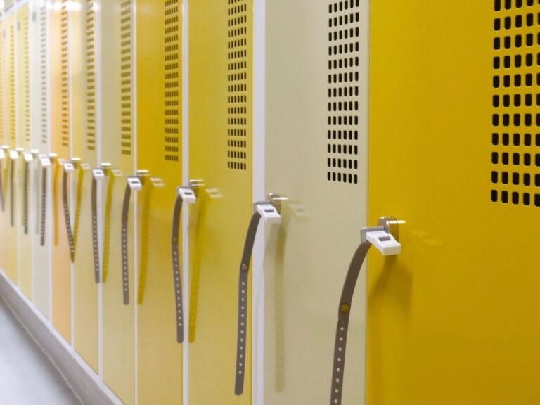 Row of yellow and cream lockers in a changing room