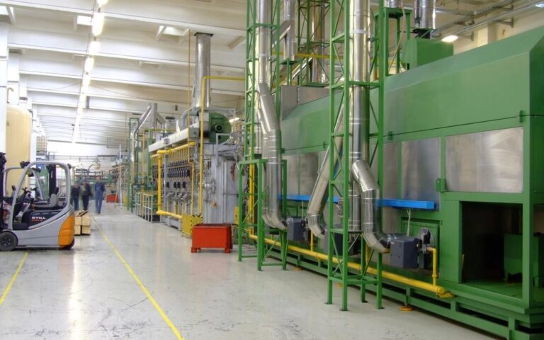 Production hall with machinery lines in a manufacturing plant