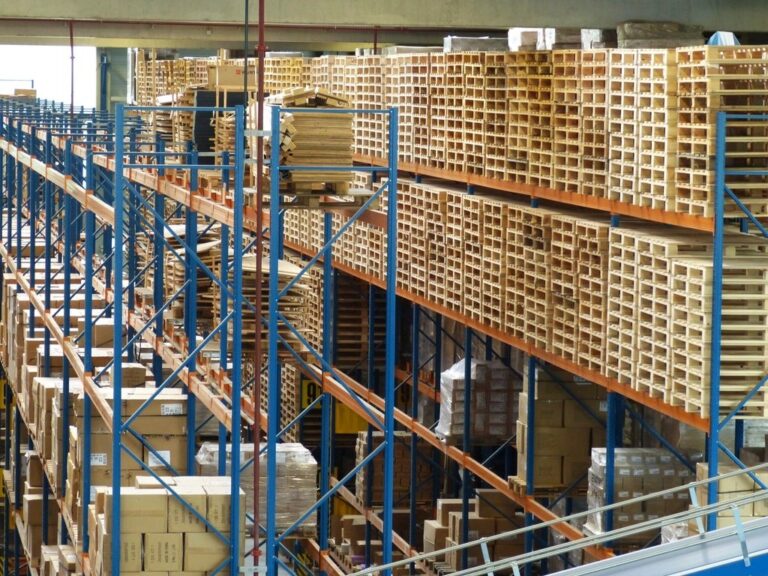 Warehouse racking stacked with materials on pallets